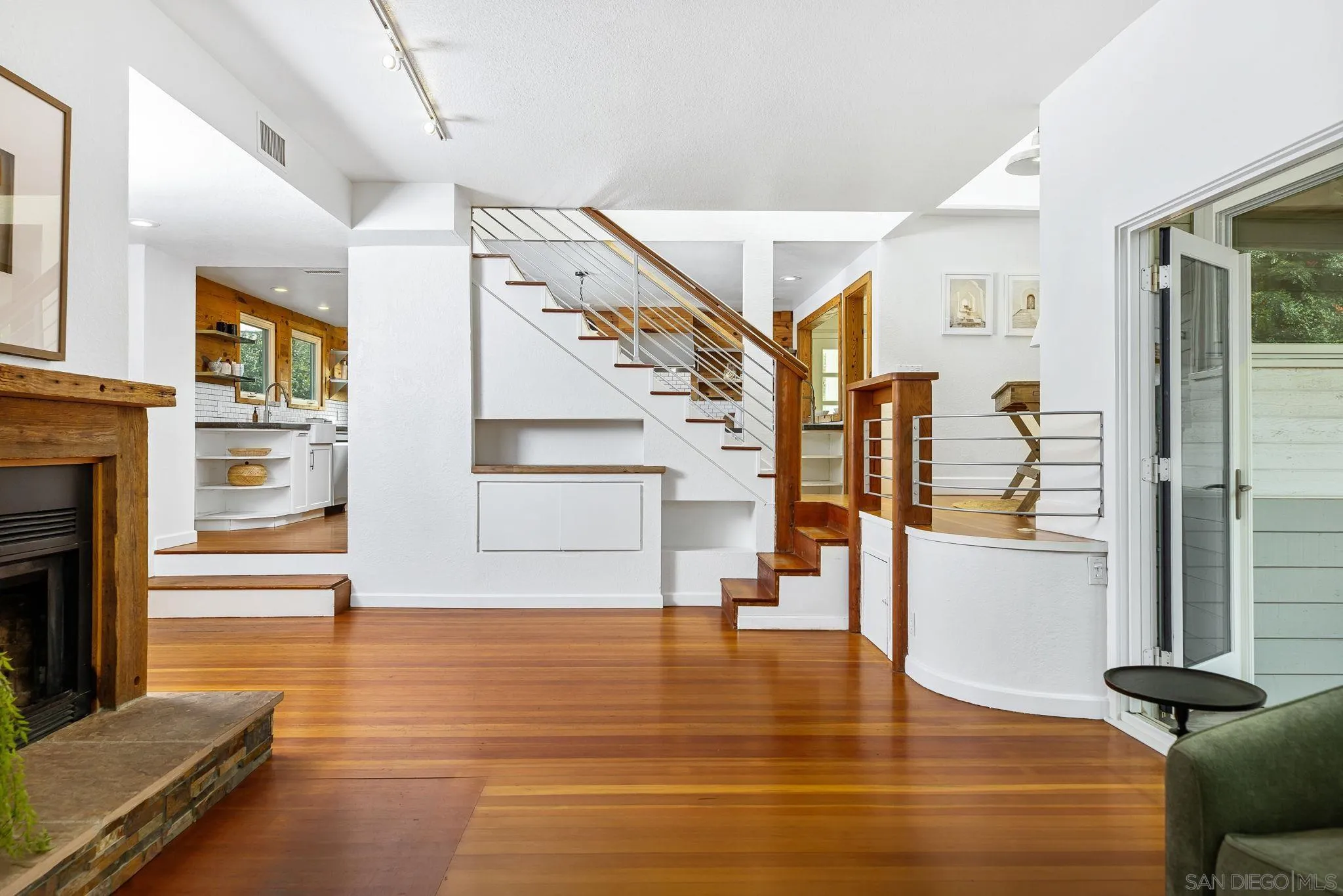 445 Sheffield Avenue Cardiff, CA 92007 - Photo 30 of 62 a view of a living room with furniture and a fireplace