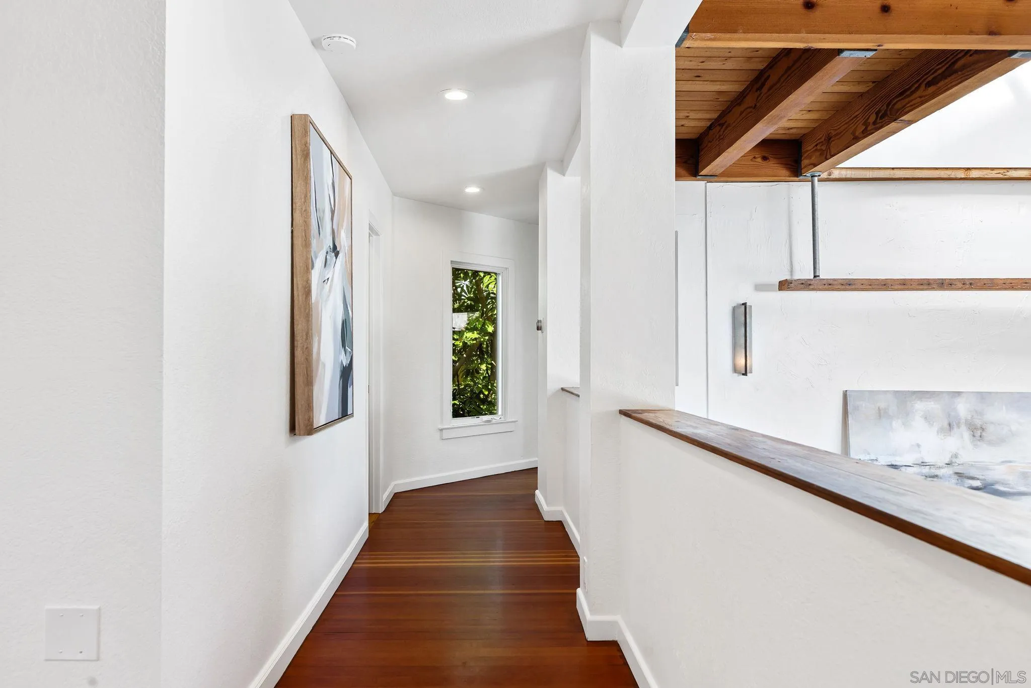 445 Sheffield Avenue Cardiff, CA 92007 - Photo 34 of 62 a hallway with wooden floor windows and stairs