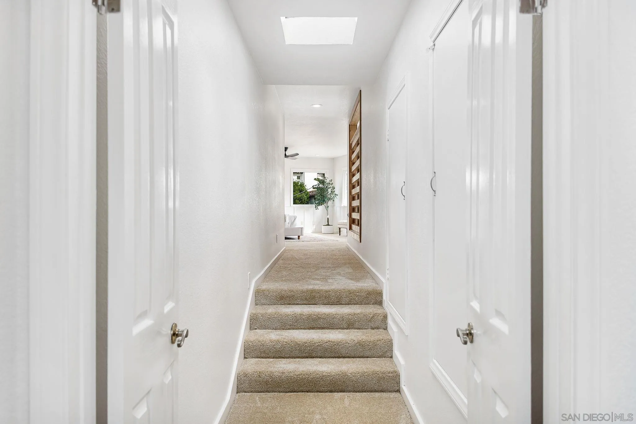 445 Sheffield Avenue Cardiff, CA 92007 - Photo 36 of 62 a view of a hallway with wooden floor and entryway