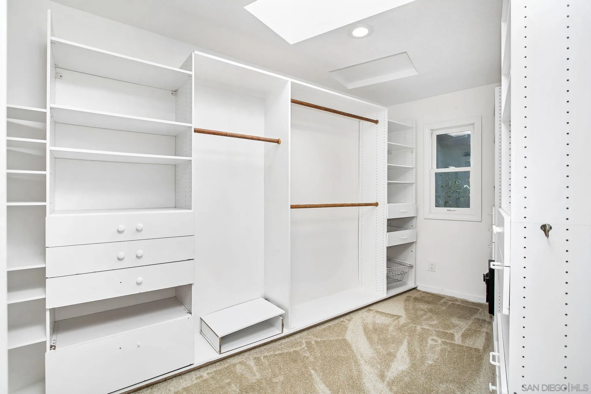 445 Sheffield Avenue Cardiff, CA 92007 - Photo 43 of 62 a view of walk in closet with empty racks