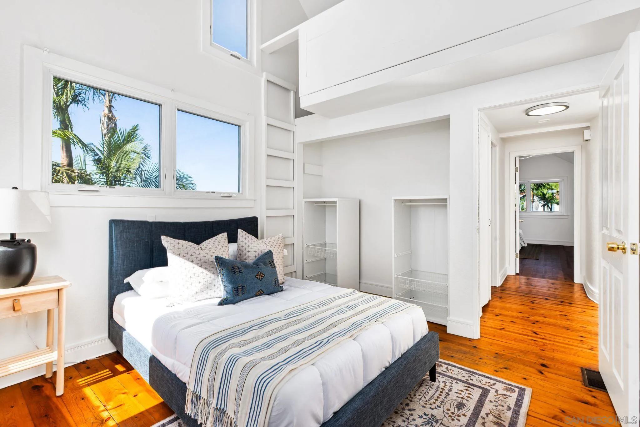 445 Sheffield Avenue Cardiff, CA 92007 - Photo 52 of 62 a bedroom with a bed and a painting on the wall