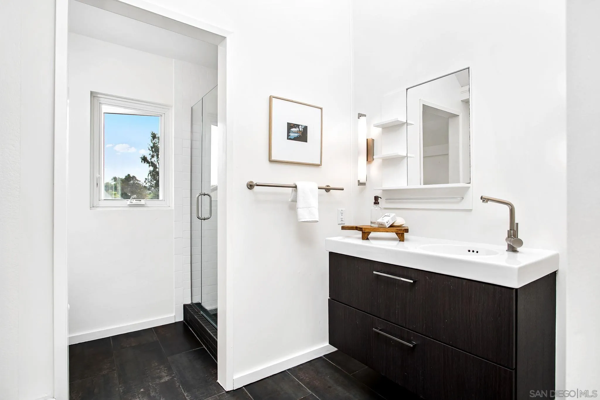 445 Sheffield Avenue Cardiff, CA 92007 - Photo 53 of 62 a room with a sink and a mirror