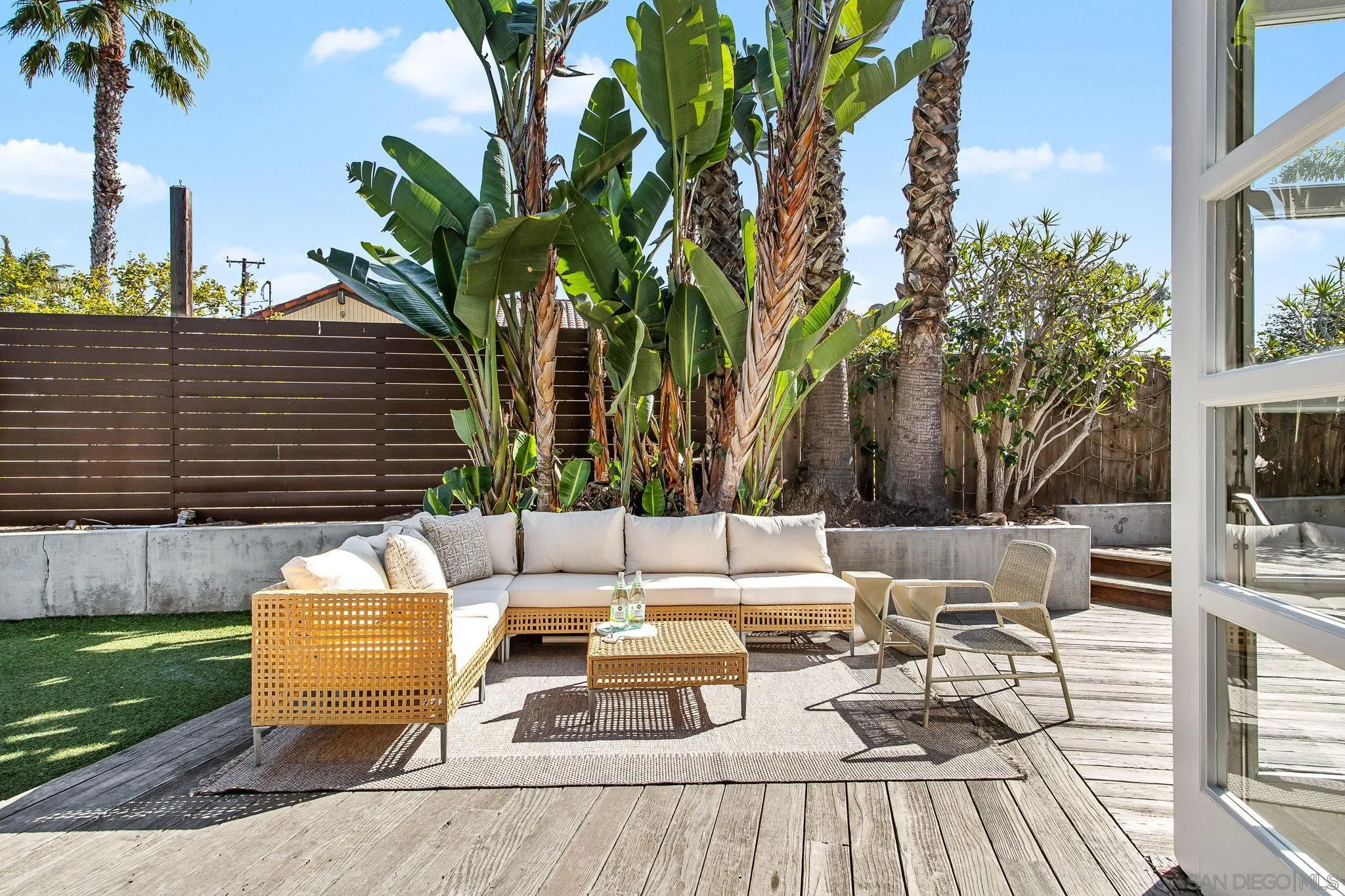 445 Sheffield Avenue Cardiff, CA 92007 - Photo 58 of 62 a view of a patio with couches and a fire pit