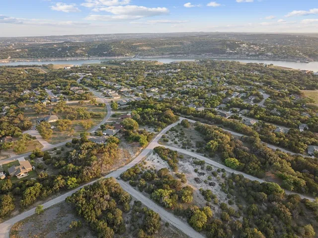 an aerial view of residential building and ocean