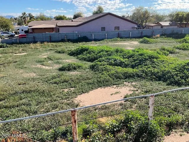 a view of a house with a small yard and plants