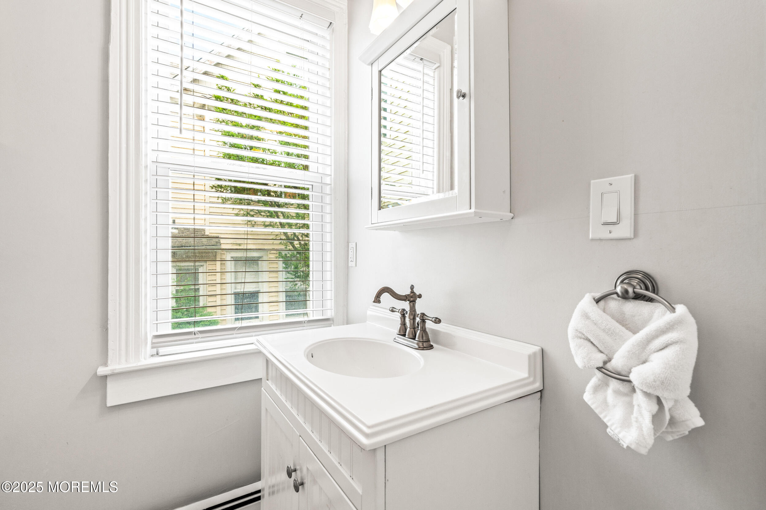 18 Abbott Avenue Ocean Grove, NJ 07756 - Photo 19 of 84 a bathroom with a sink and a window