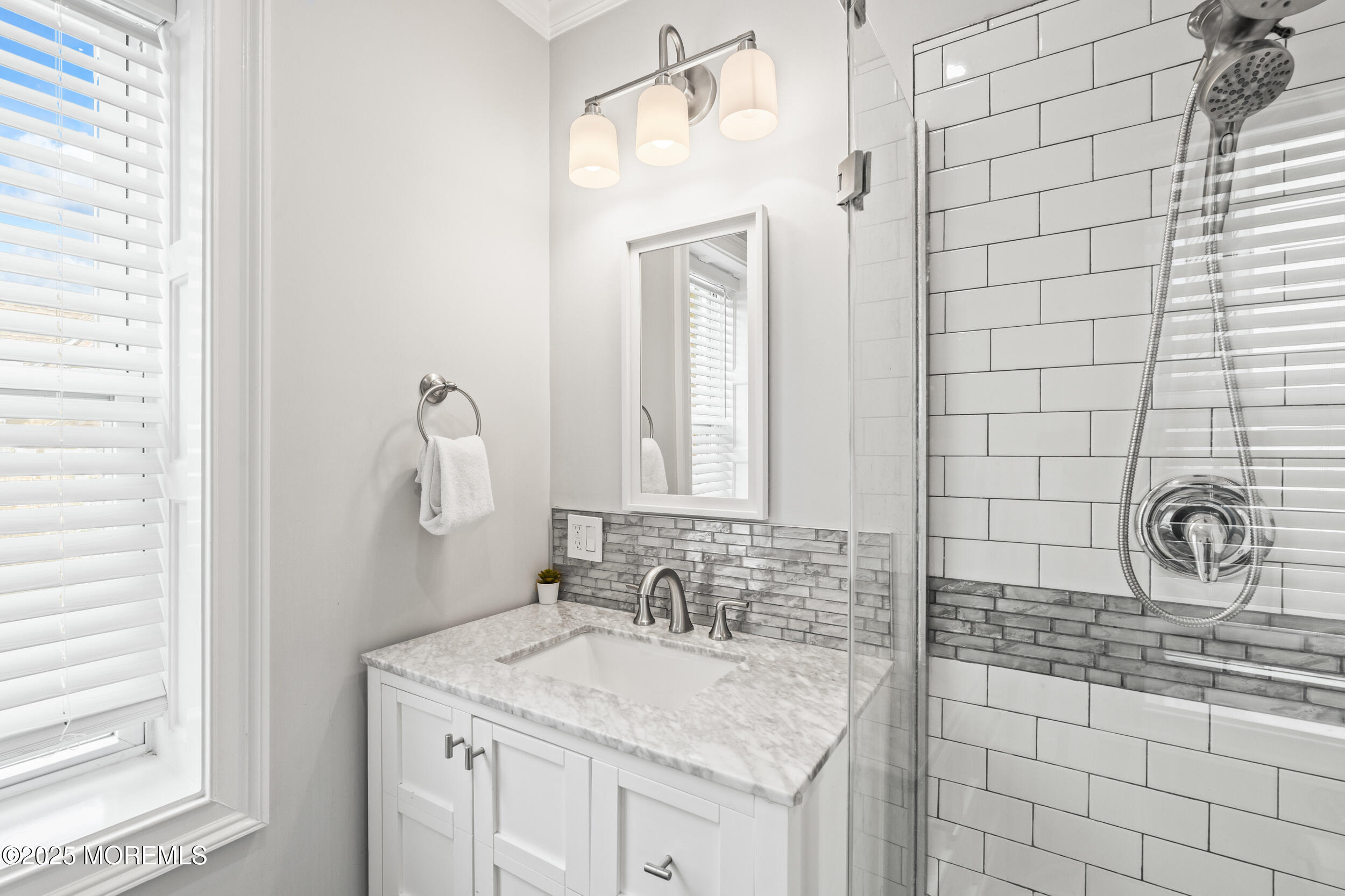 18 Abbott Avenue Ocean Grove, NJ 07756 - Photo 33 of 84 a bathroom with a sink and a mirror