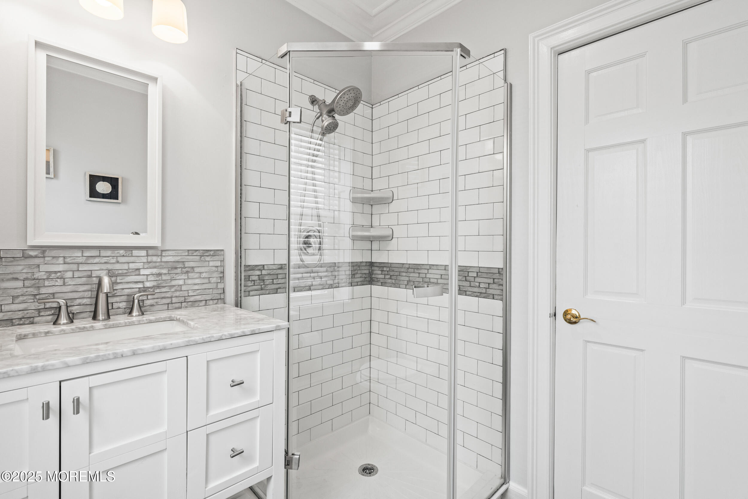 18 Abbott Avenue Ocean Grove, NJ 07756 - Photo 34 of 84 a bathroom with a shower sink and mirror