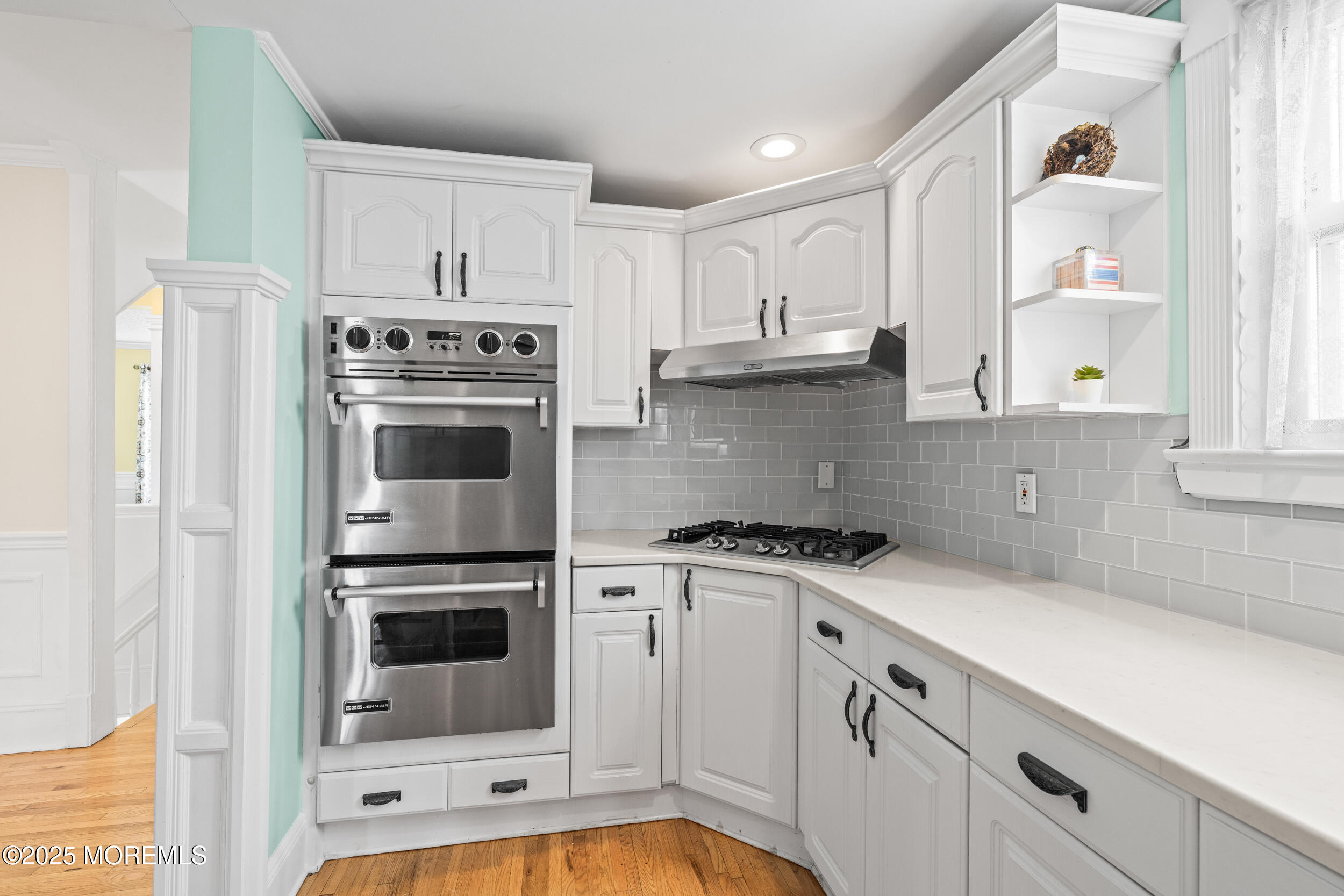 18 Abbott Avenue Ocean Grove, NJ 07756 - Photo 37 of 84 a kitchen with granite countertop white cabinets and stainless steel appliances