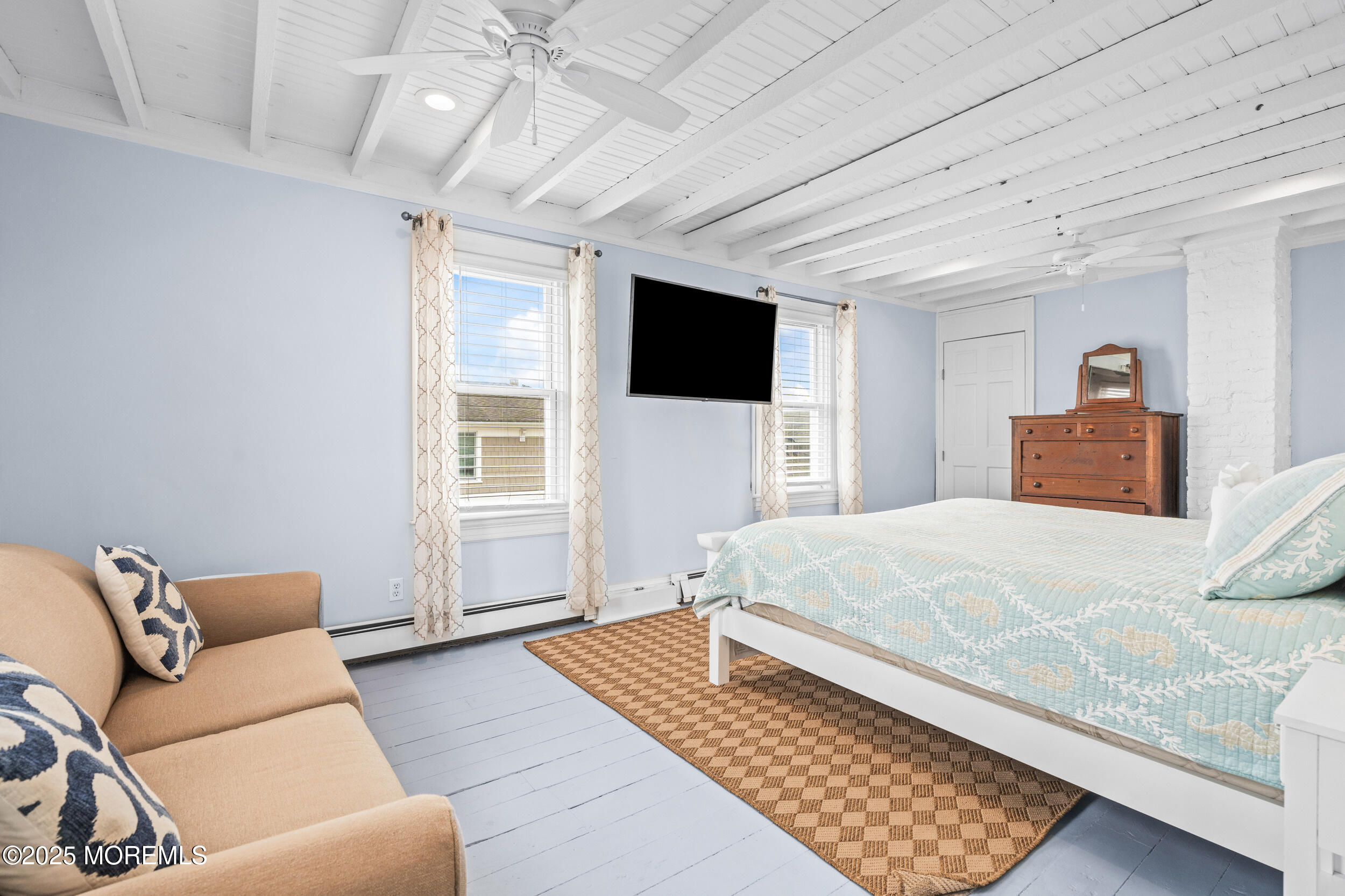 18 Abbott Avenue Ocean Grove, NJ 07756 - Photo 47 of 84 a bedroom with a large bed and a flat screen tv