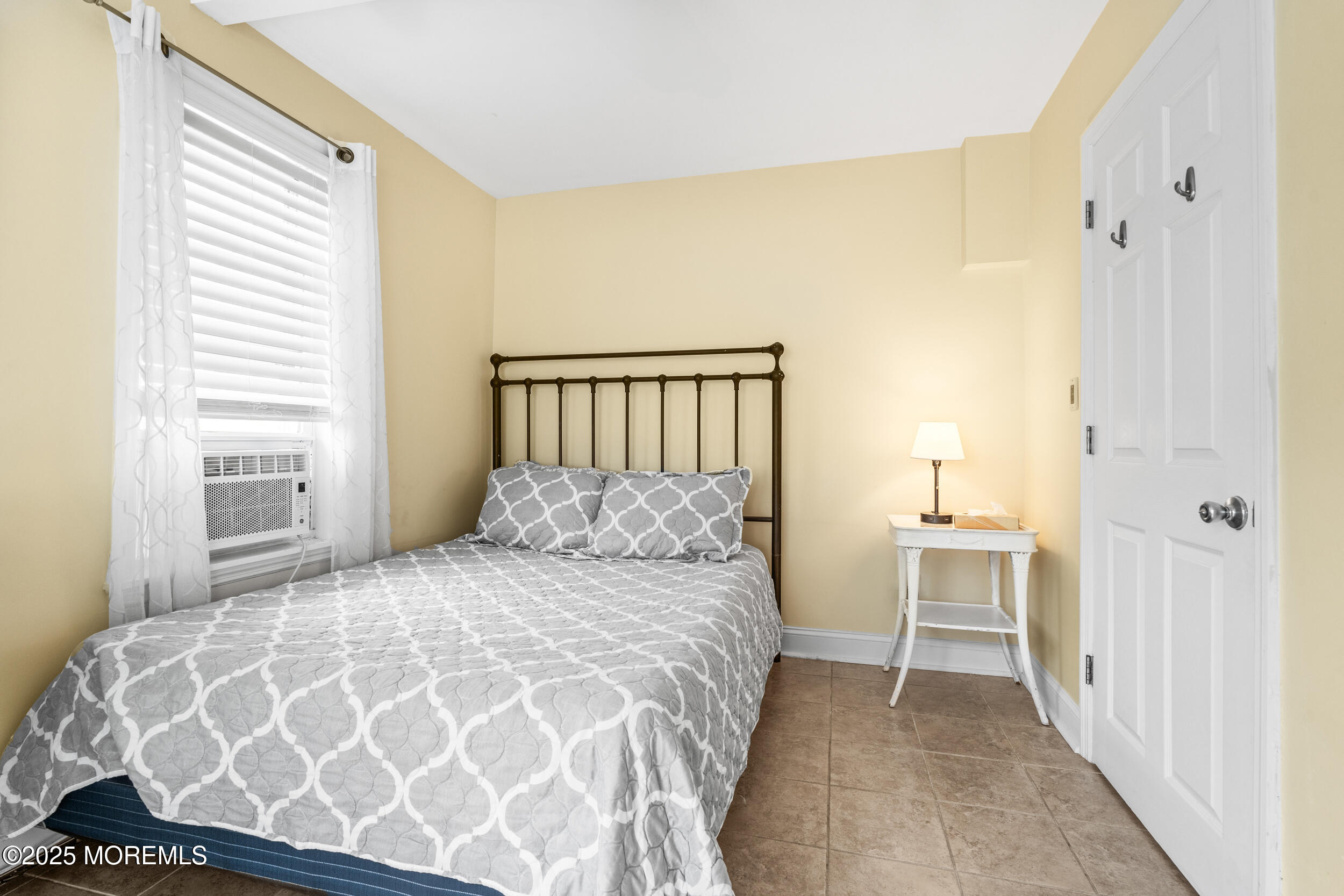 18 Abbott Avenue Ocean Grove, NJ 07756 - Photo 76 of 84 a bedroom with a large bed and a window