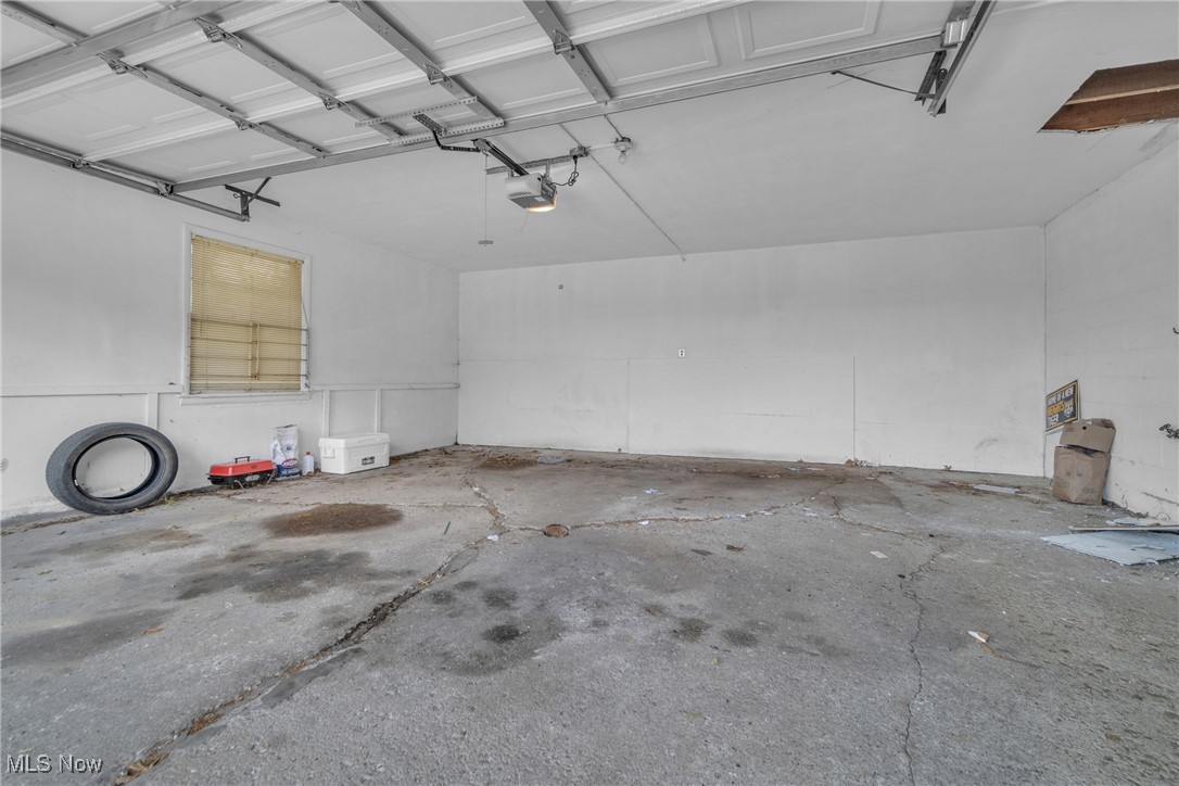 2307 Noble Road Cleveland, OH 44121 - Photo 28 of 29 Garage featuring a garage door opener
