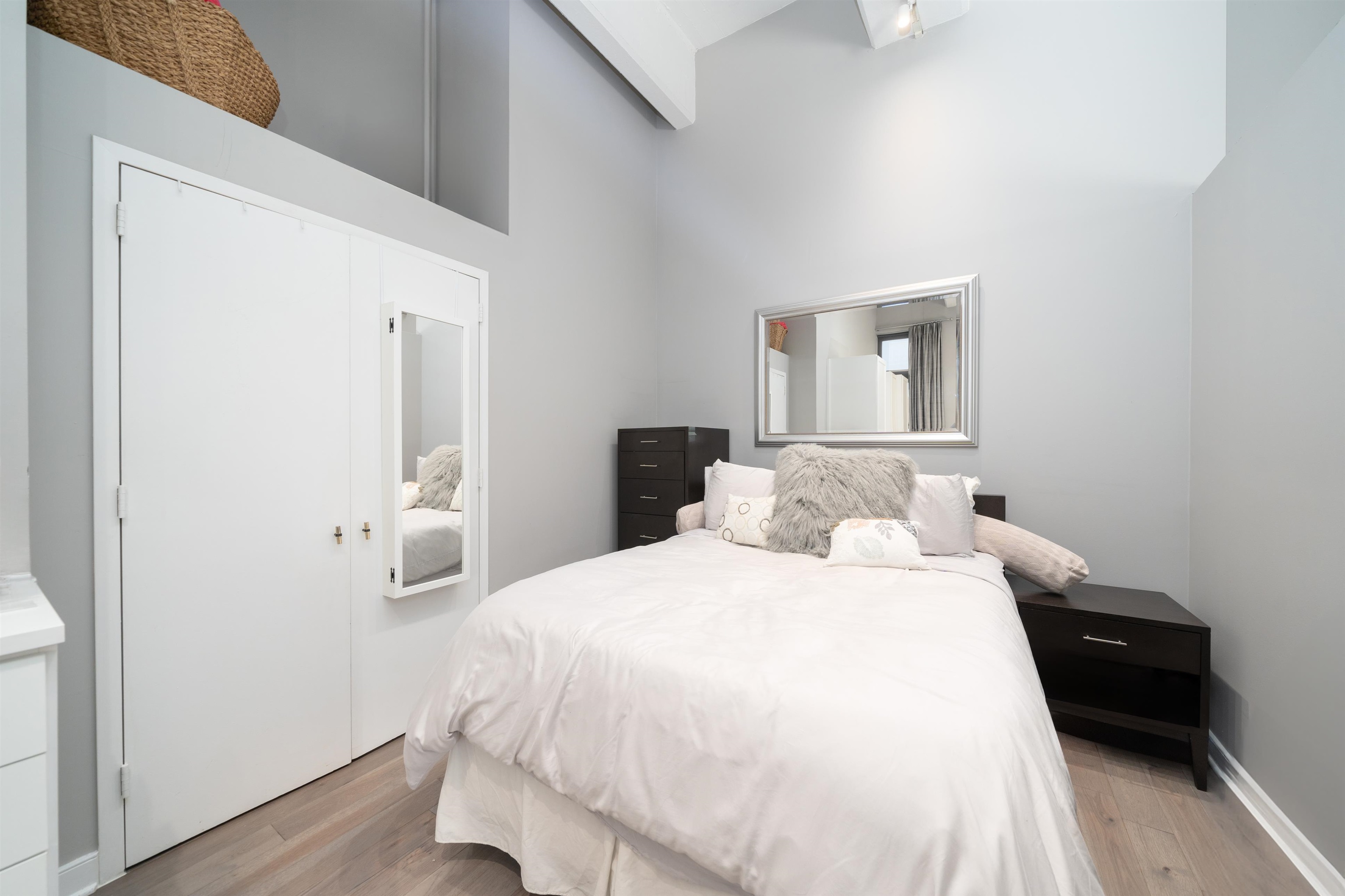 1500 Washington Street, Unit 8T Hoboken, NJ 07030 - Photo 12 of 50 a bedroom with a bed and wooden floor