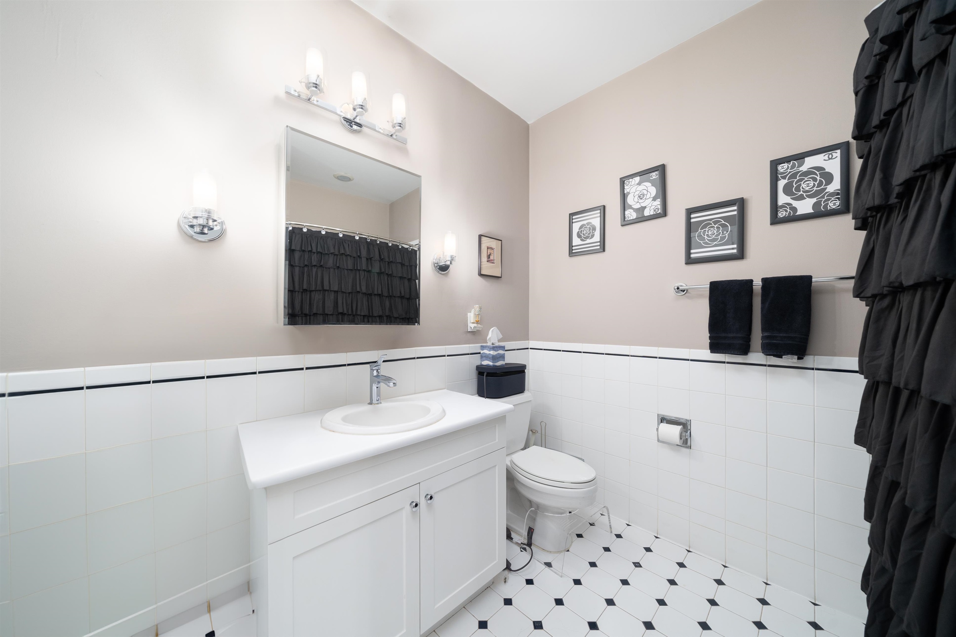 1500 Washington Street, Unit 8T Hoboken, NJ 07030 - Photo 15 of 50 a bathroom with a sink a toilet a mirror and shower