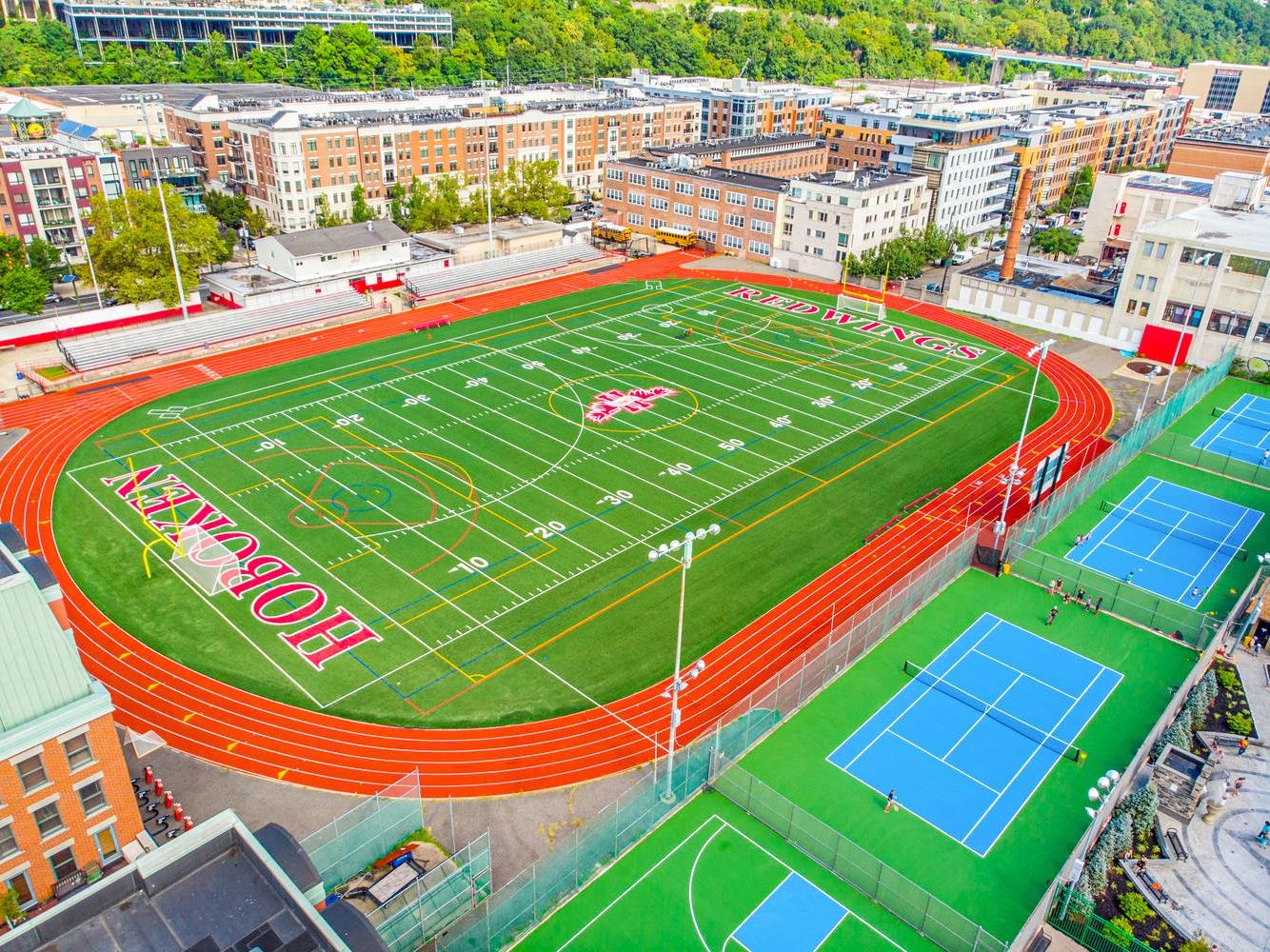 1500 Washington Street, Unit 8T Hoboken, NJ 07030 - Photo 40 of 50 a view of a tennis ground with large trees