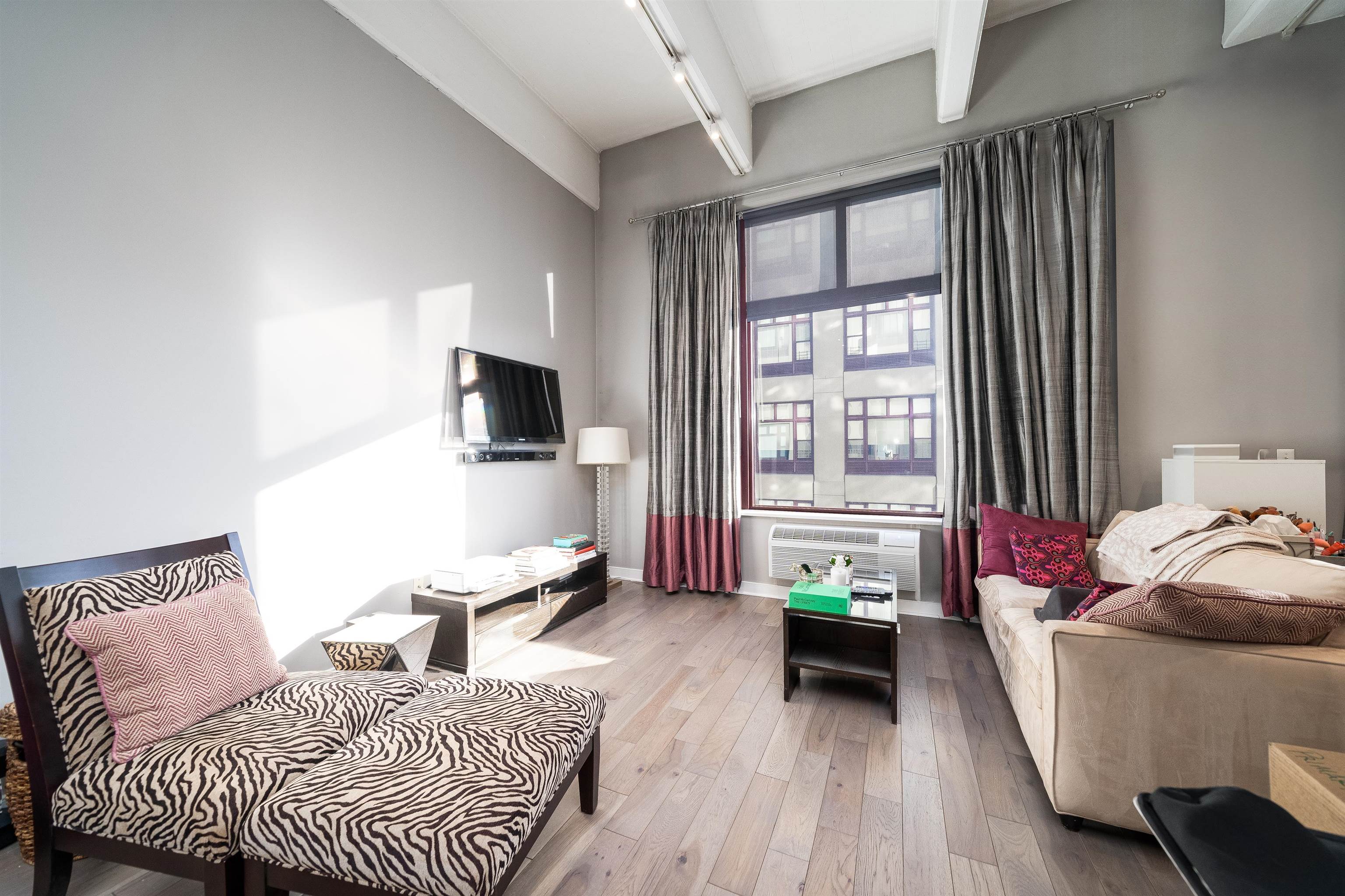 1500 Washington Street, Unit 8T Hoboken, NJ 07030 - Photo 4 of 50 a bedroom with a bed and flat screen tv