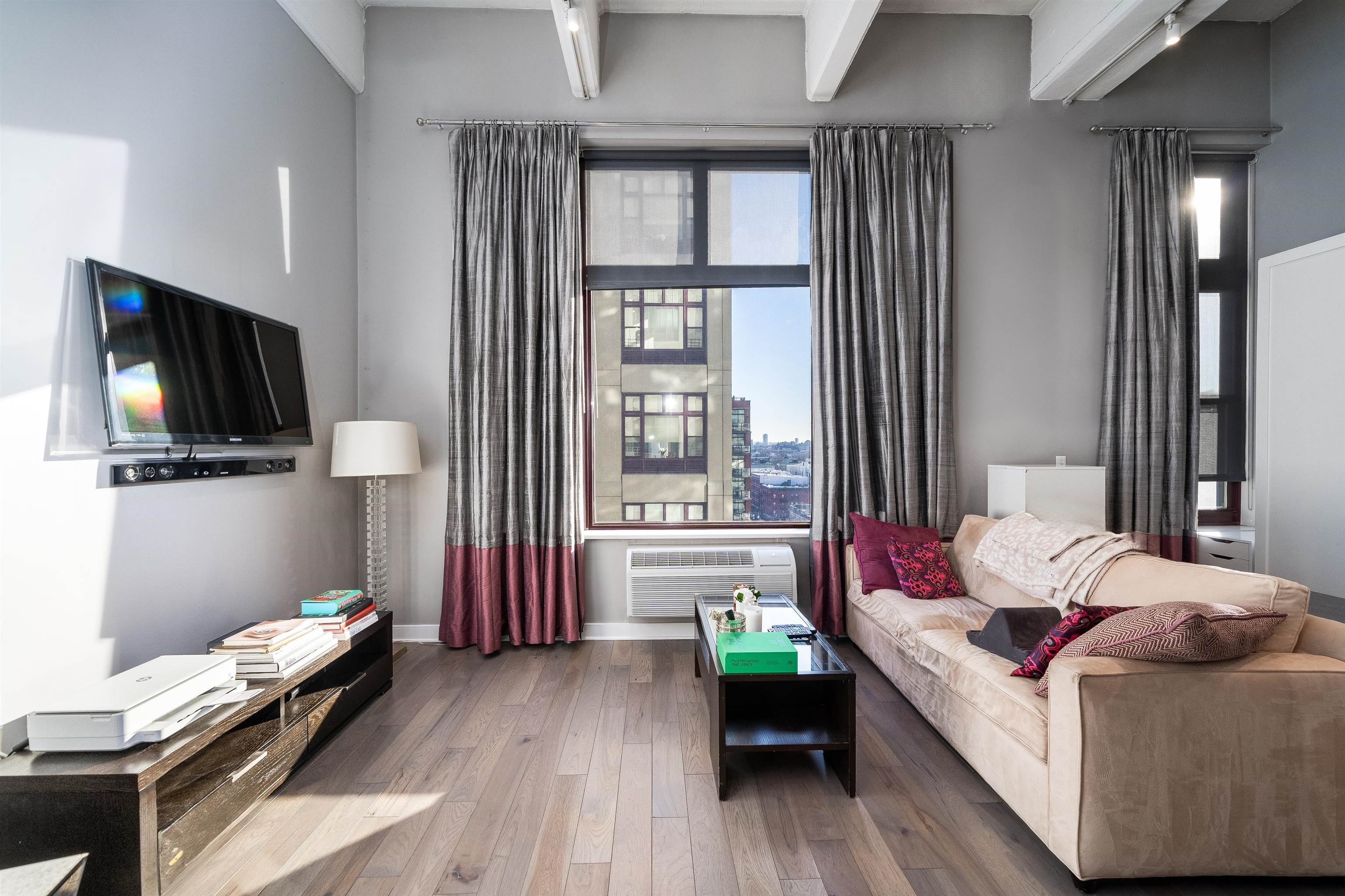 1500 Washington Street, Unit 8T Hoboken, NJ 07030 - Photo 5 of 50 a bedroom with a bed and a flat tv screen