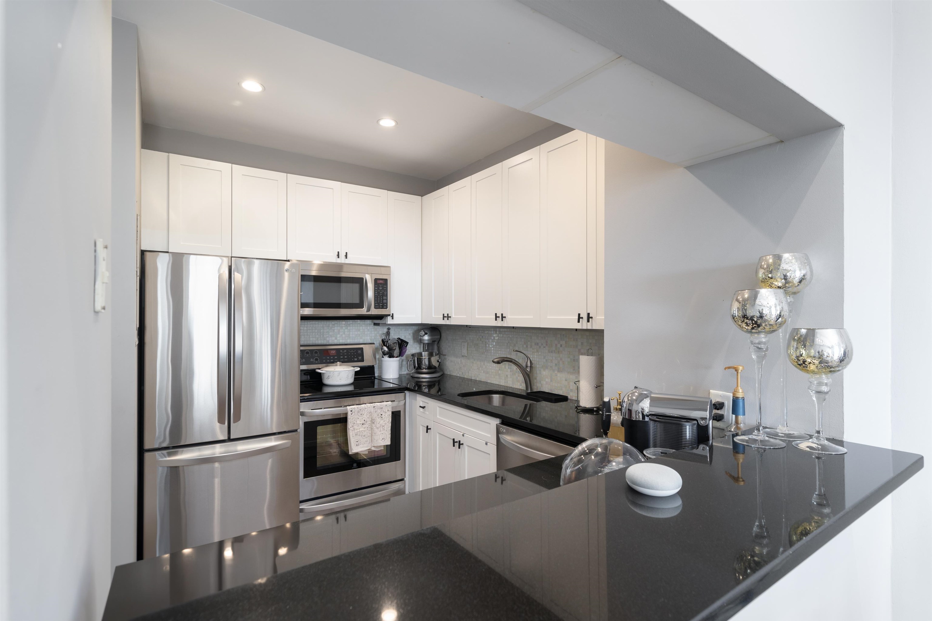 1500 Washington Street, Unit 8T Hoboken, NJ 07030 - Photo 6 of 50 a kitchen with refrigerator and cabinets