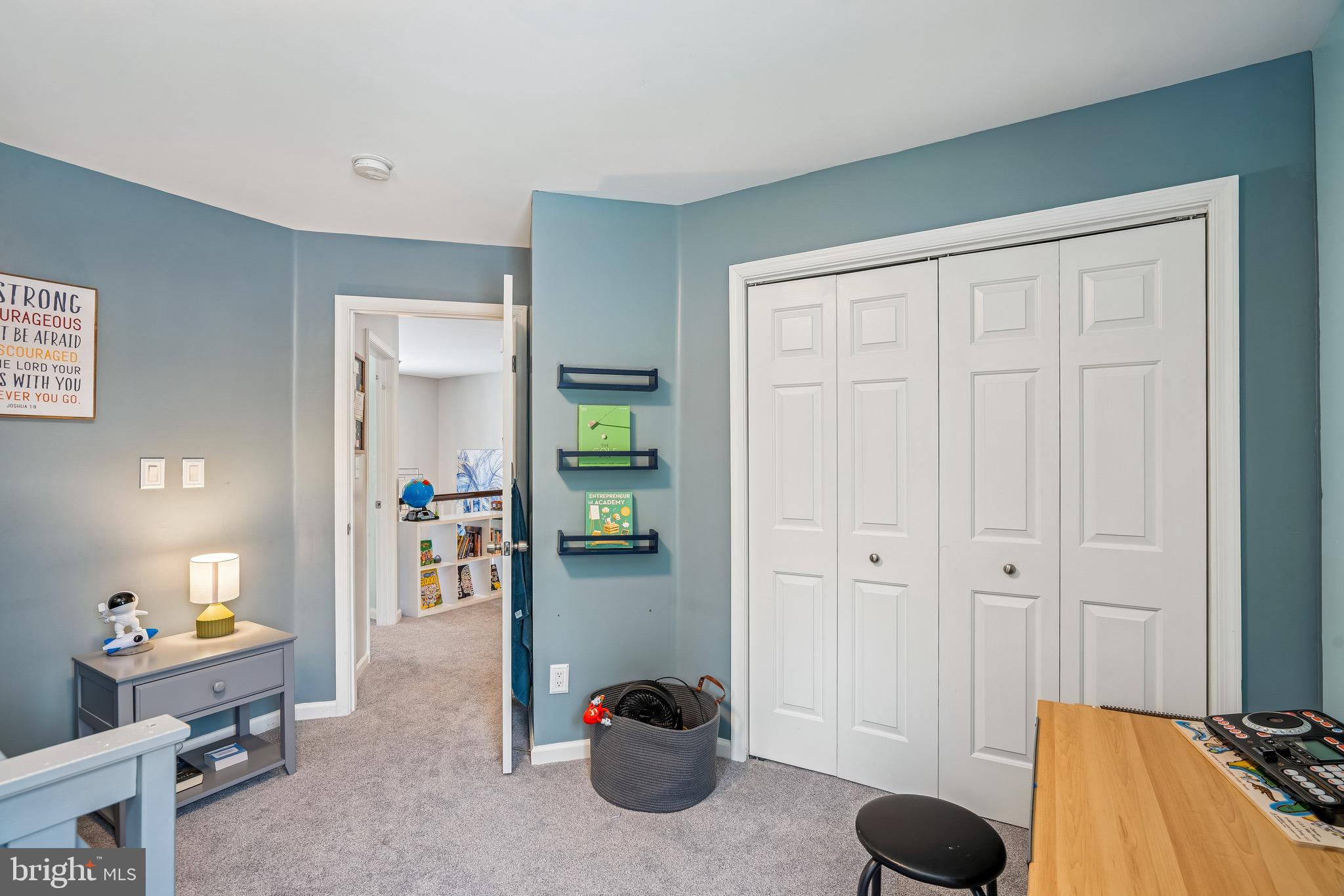 454 North Patuxent Road Odenton, MD 21113 - Photo 16 of 41 a bedroom with a bed and a chandelier