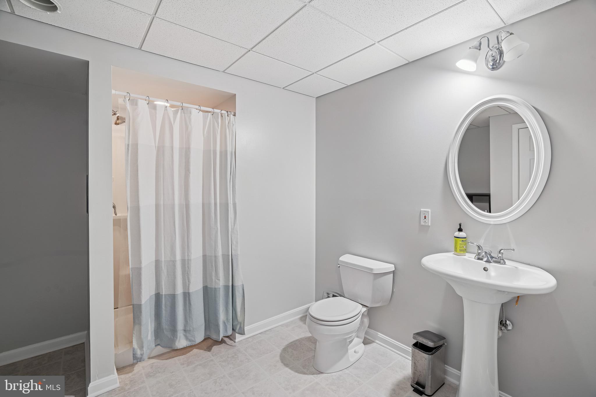 454 North Patuxent Road Odenton, MD 21113 - Photo 30 of 41 a bathroom with a toilet sink and mirror
