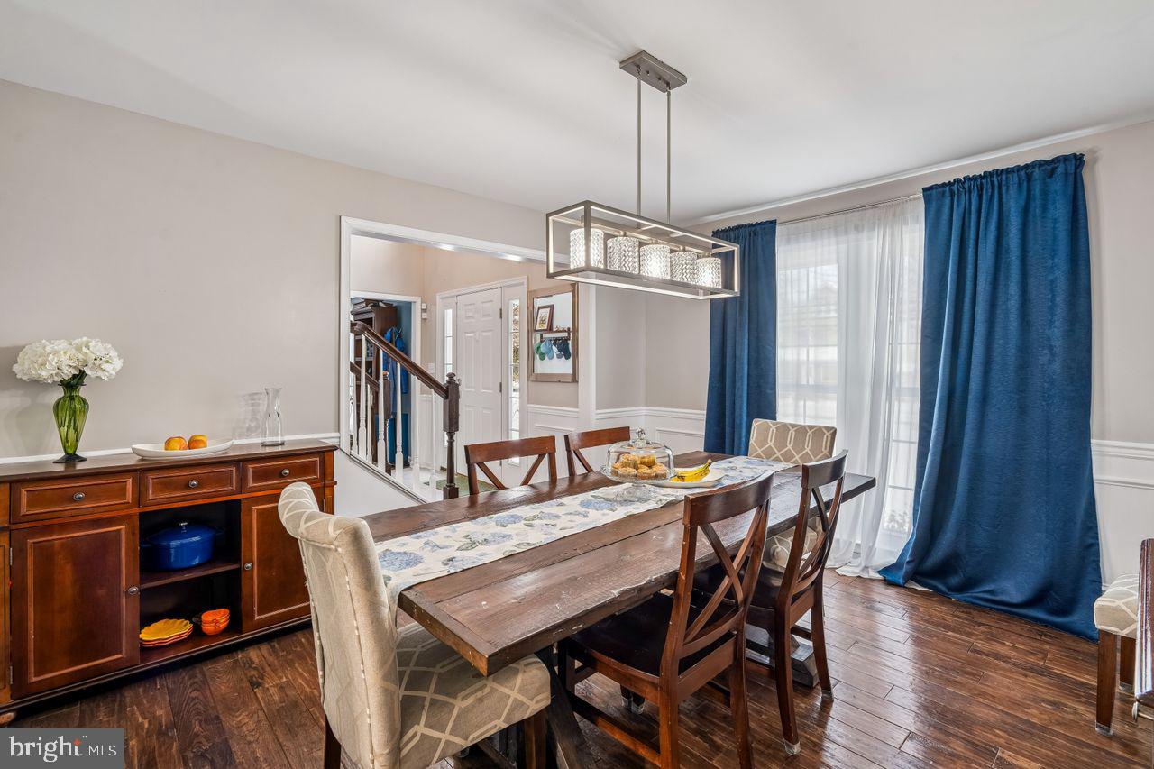 454 North Patuxent Road Odenton, MD 21113 - Photo 4 of 41 a view of a dining room with furniture window and wooden floor