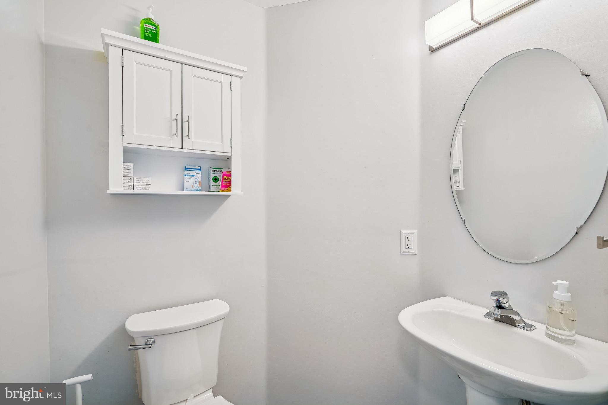 454 North Patuxent Road Odenton, MD 21113 - Photo 6 of 41 a bathroom with a sink mirror and toilet