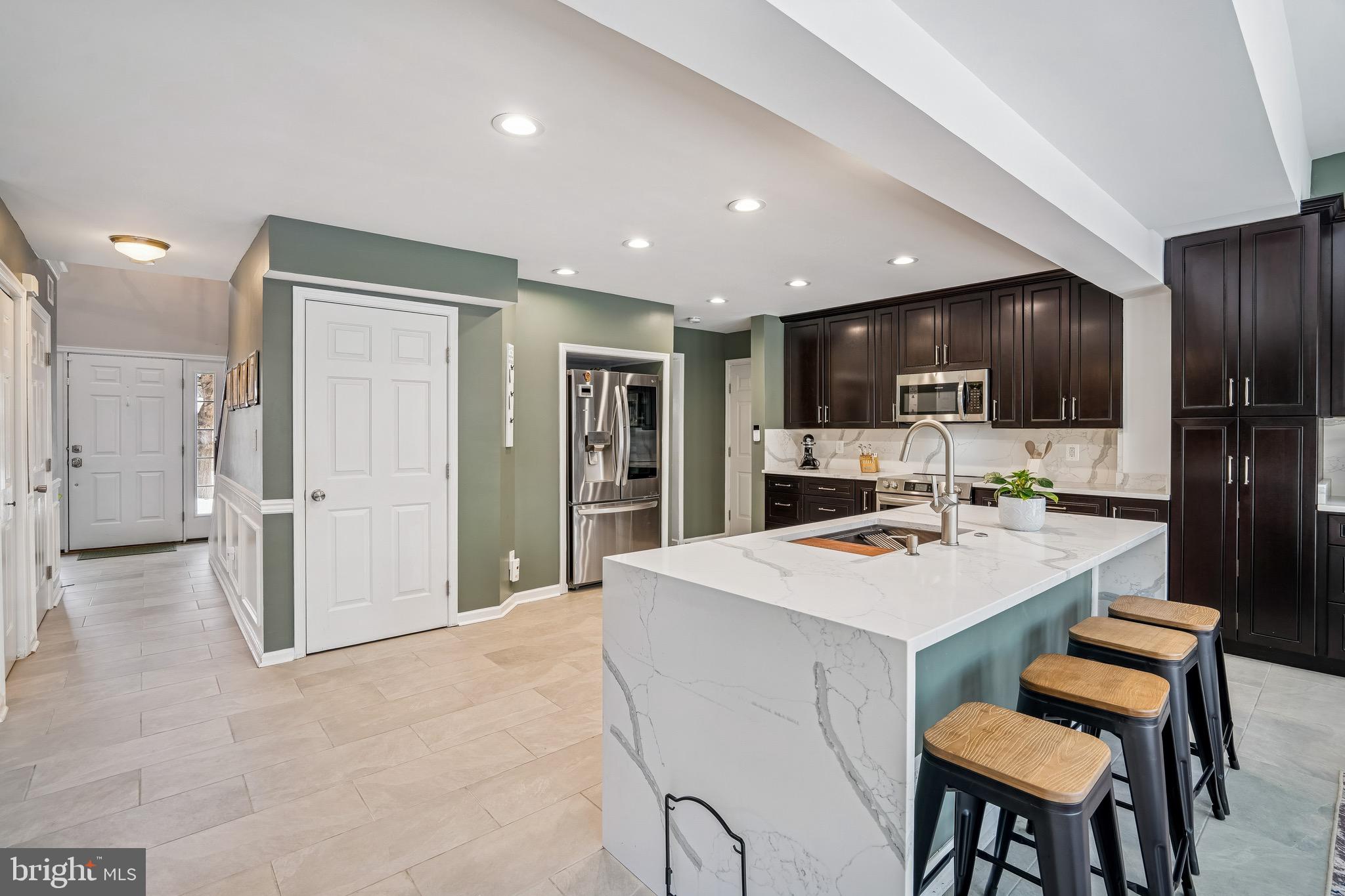454 North Patuxent Road Odenton, MD 21113 - Photo 8 of 41 a large kitchen with a table and chairs