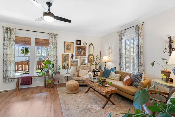 a view of a dining room with furniture window and wooden floor