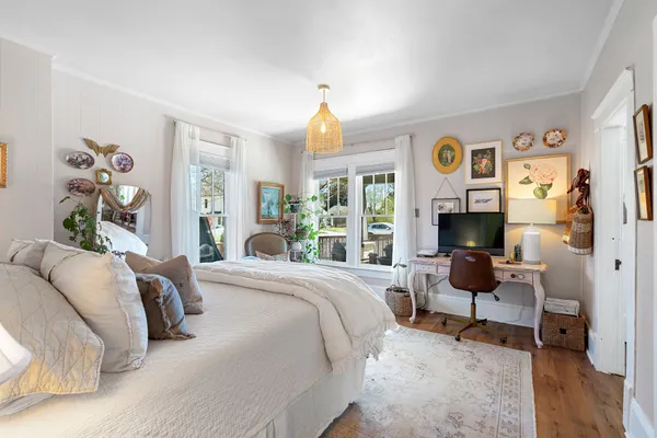 a living room with furniture and a book shelf