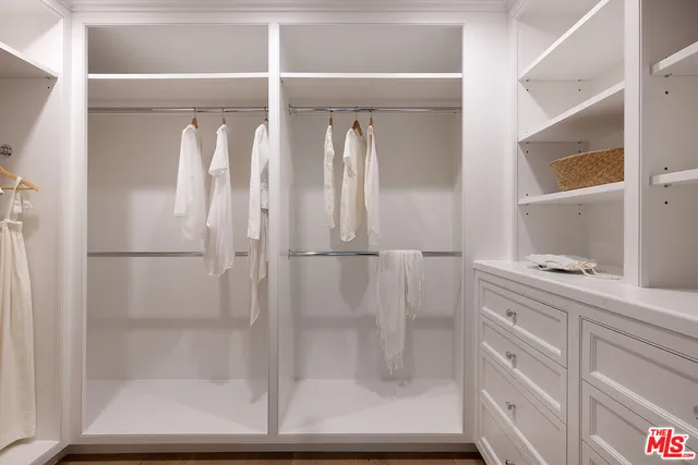 a bedroom with furniture and windows