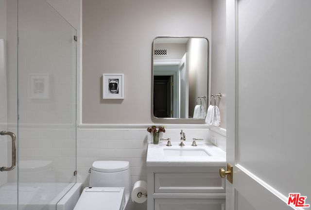a walk in closet with a shower