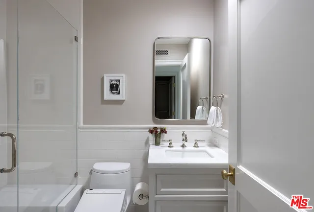 a walk in closet with a shower