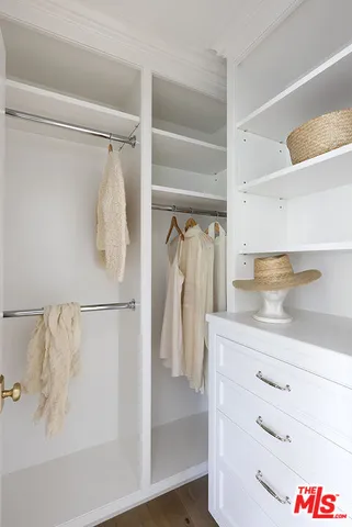 a bedroom with bed and a window