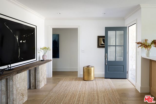 a view of an empty room with closet and a window