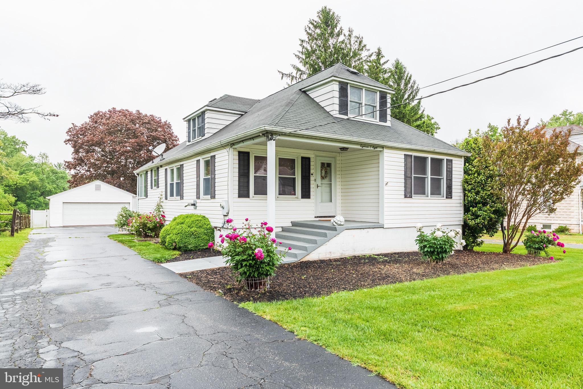 1808 Harford Road Fallston, MD 21047 - Photo 1 of 54 a front view of a house with a garden and plants