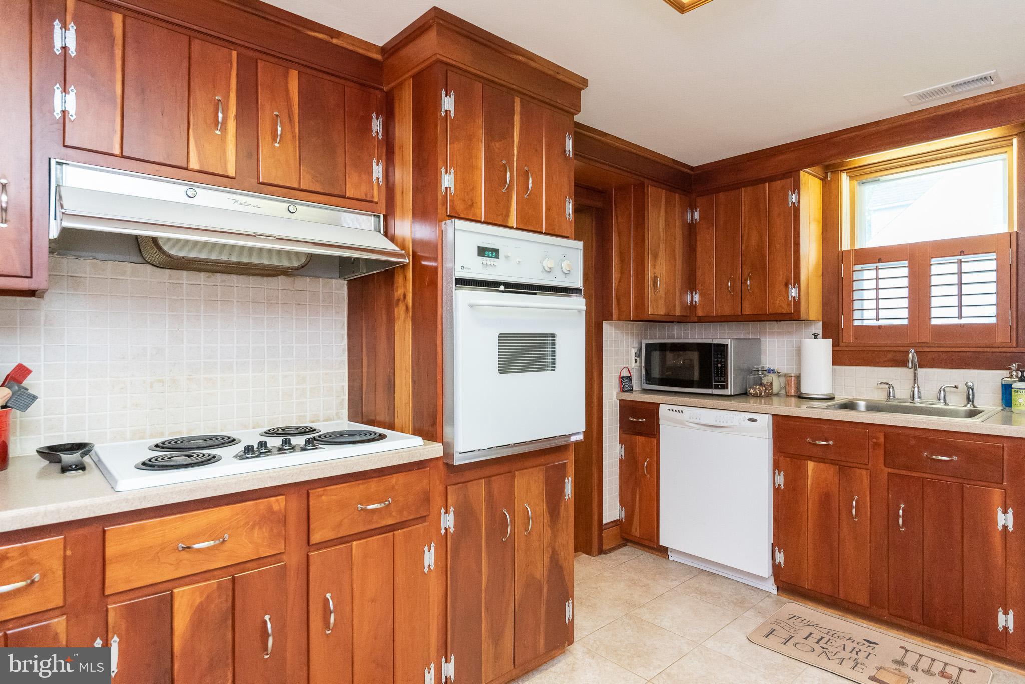 1808 Harford Road Fallston, MD 21047 - Photo 14 of 54 a kitchen with stainless steel appliances granite countertop a stove a sink dishwasher and a refrigerator
