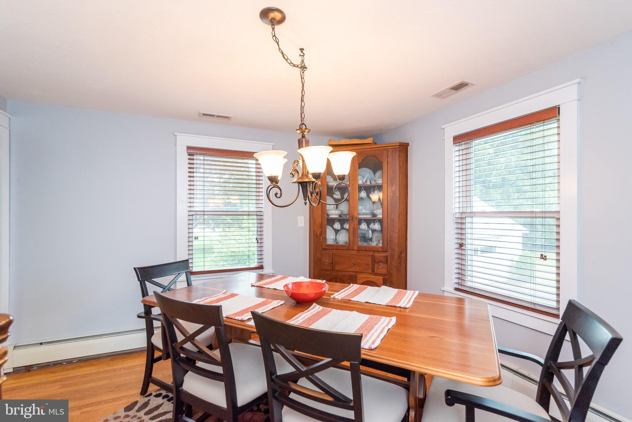 1808 Harford Road Fallston, MD 21047 - Photo 18 of 54 a dining room with furniture a chandelier and wooden floor