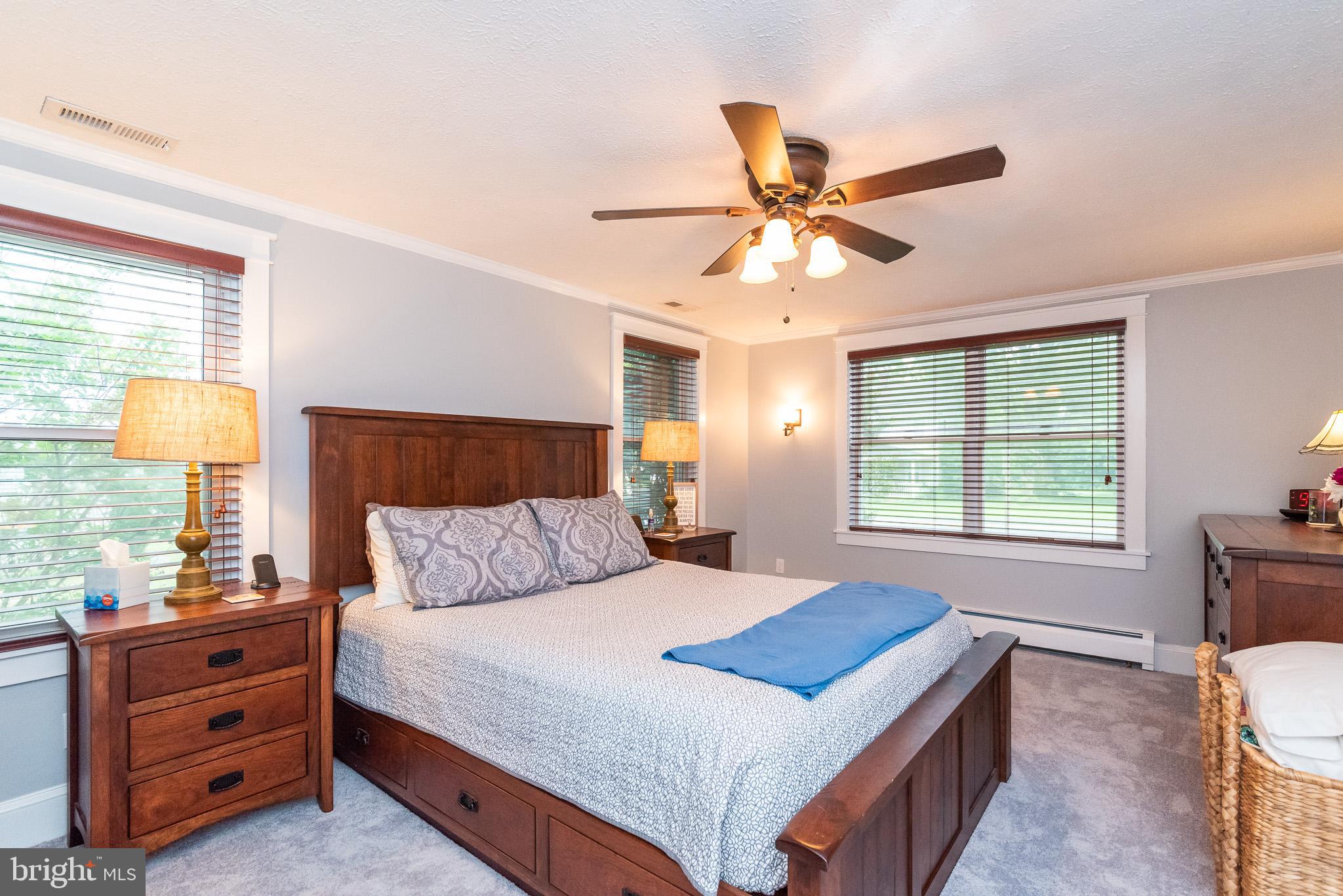 1808 Harford Road Fallston, MD 21047 - Photo 22 of 54 a bedroom with a bed and a chandelier