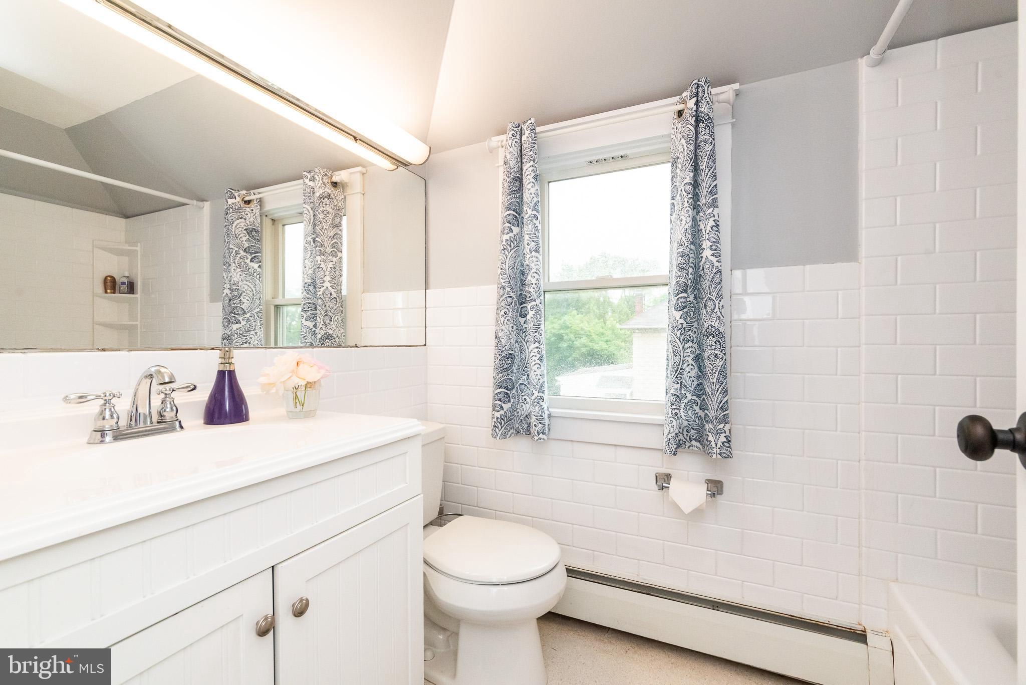 1808 Harford Road Fallston, MD 21047 - Photo 33 of 54 a bathroom with a sink toilet vanity and tub