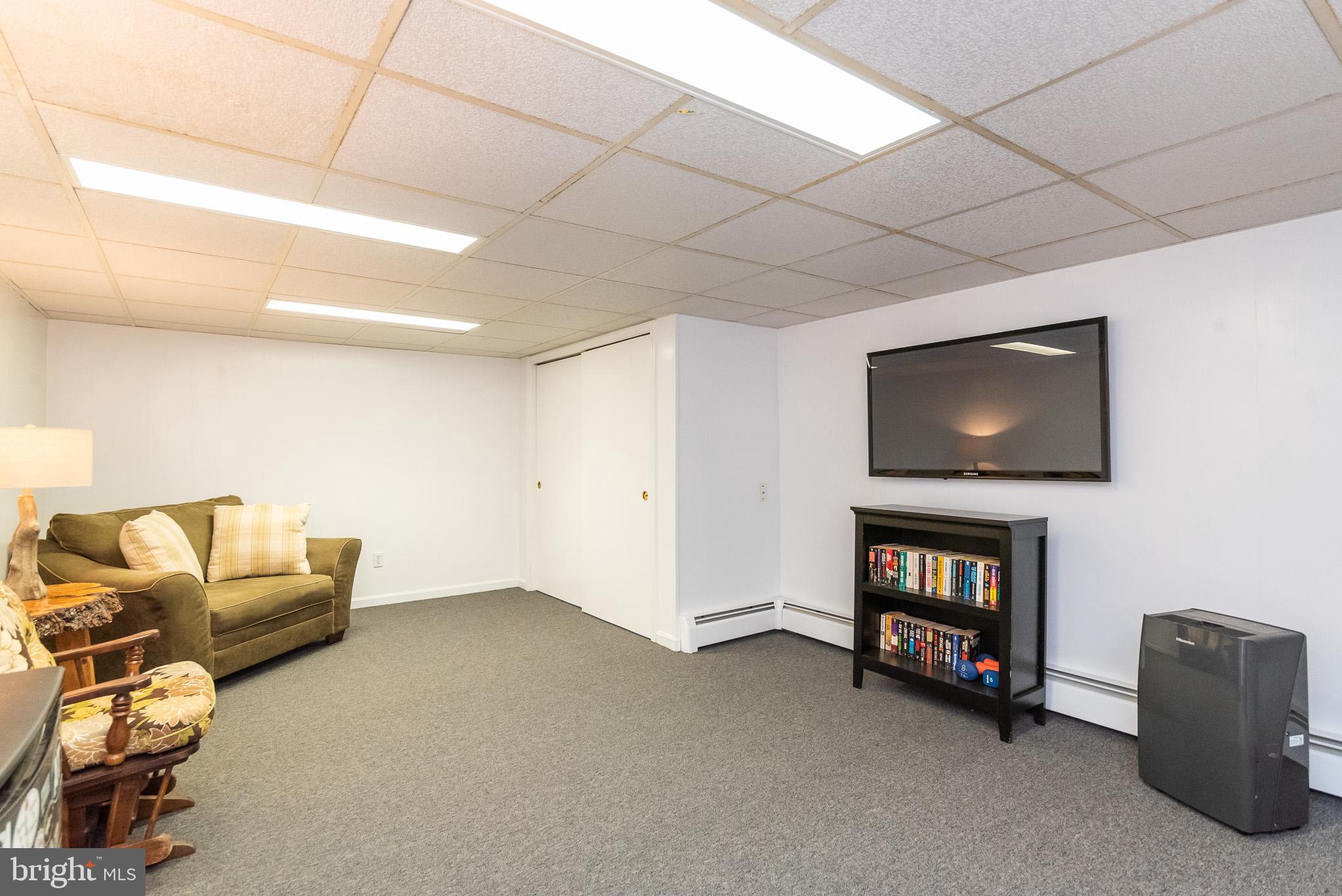 1808 Harford Road Fallston, MD 21047 - Photo 40 of 54 a living room with furniture and a flat screen tv