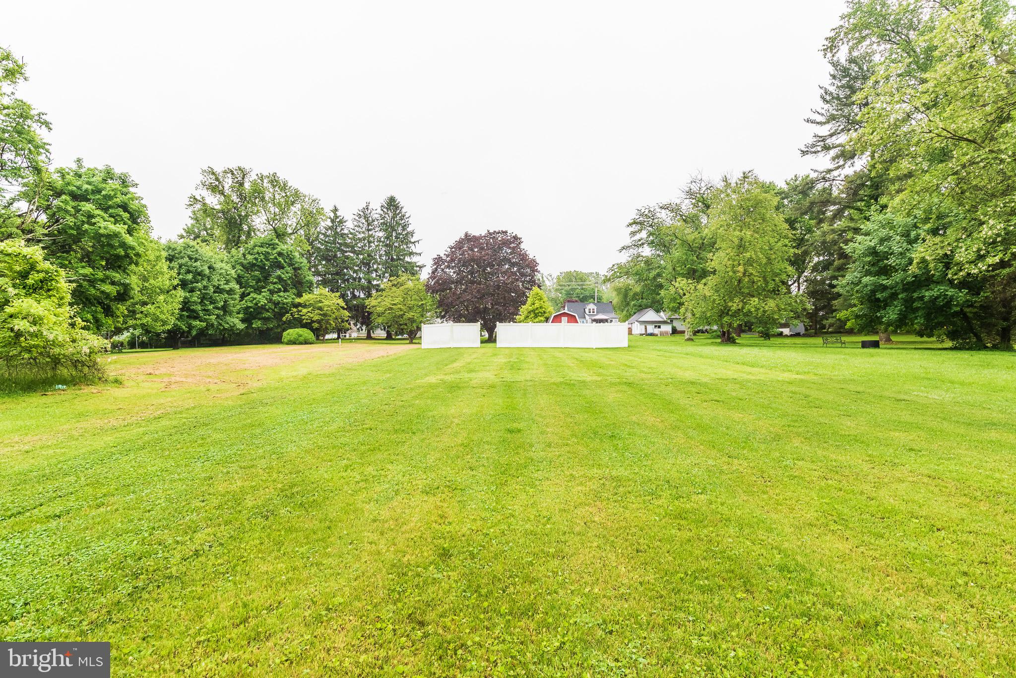1808 Harford Road Fallston, MD 21047 - Photo 47 of 54 a view of a green field with trees in the background