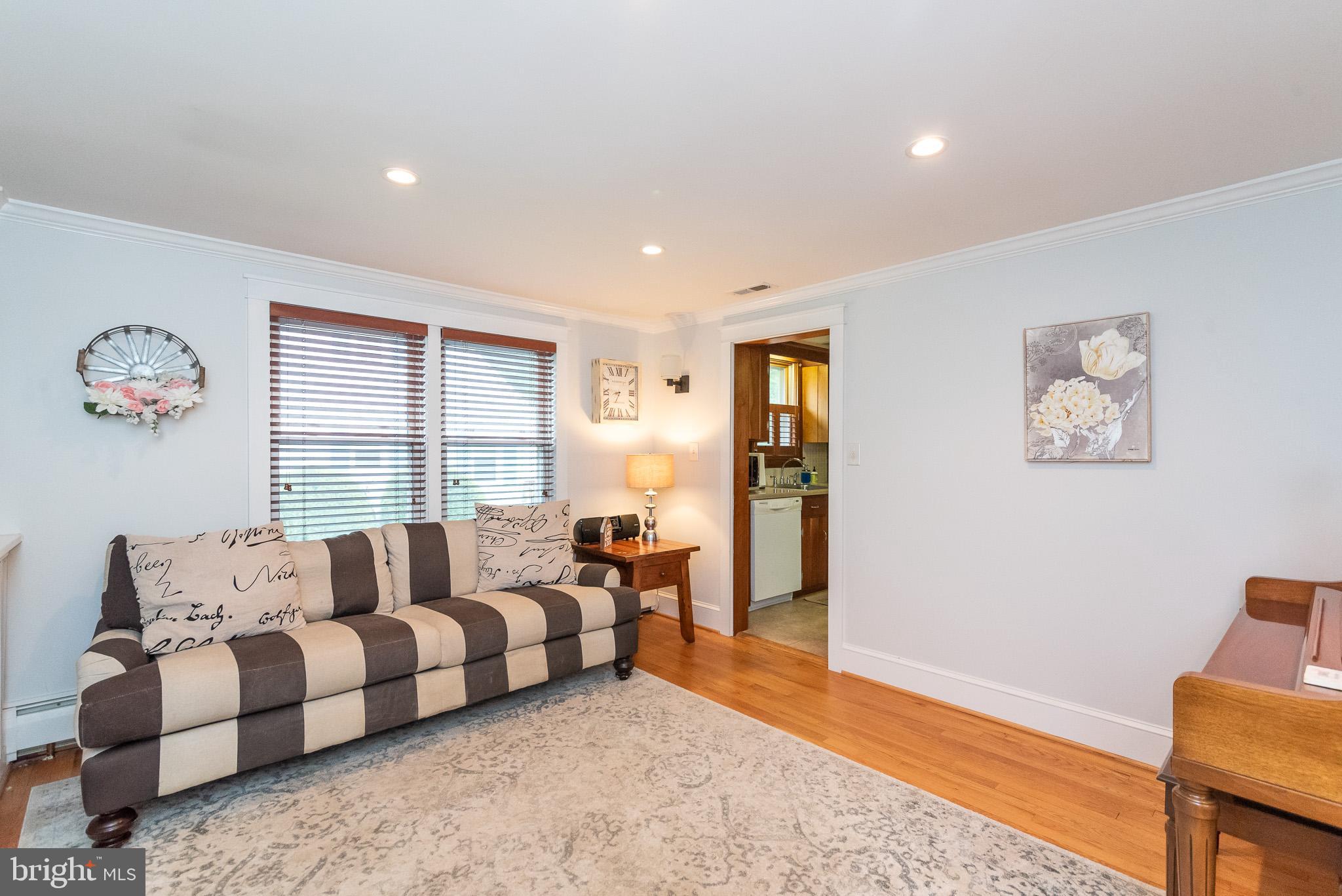 1808 Harford Road Fallston, MD 21047 - Photo 8 of 54 a spacious bedroom with a bed and a couch