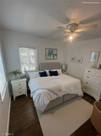 a bedroom with bed and window