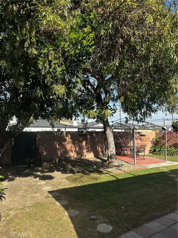 a view of a water fountain in front of a house