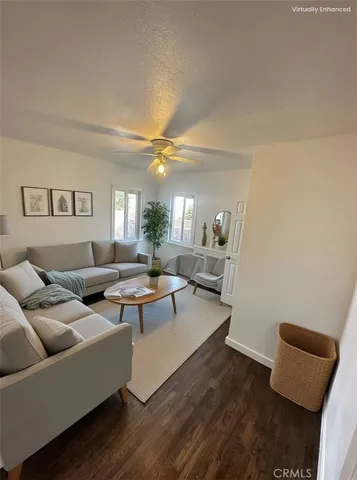 a living room with furniture and a lamp