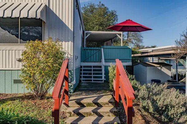 a backyard of a house with seating space