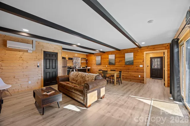 a dining room with furniture water view and a large window