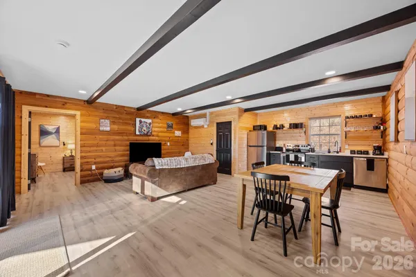 a kitchen with stainless steel appliances granite countertop a refrigerator and a stove