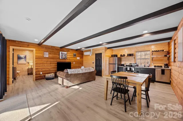 a kitchen with stainless steel appliances granite countertop a refrigerator and a stove