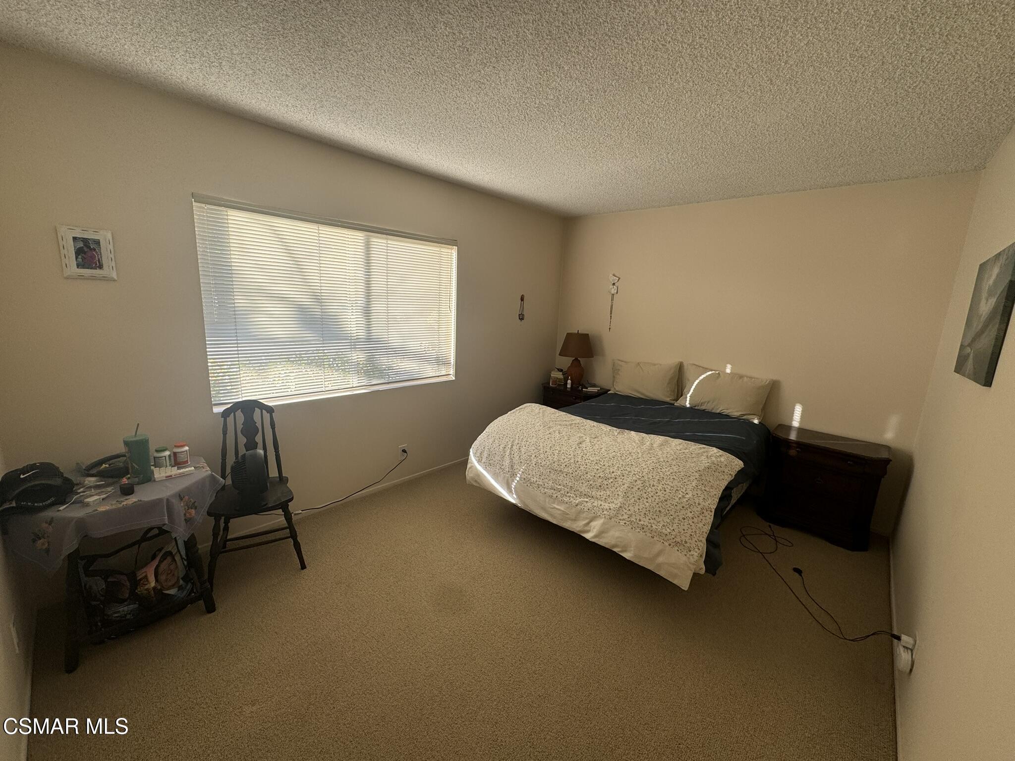 2623 Avenida Simi Simi Valley, CA 93065 - Photo 14 of 24 a bedroom with bed chair and window